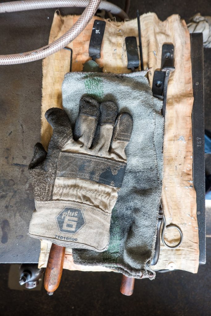 white and gray gloves on towel